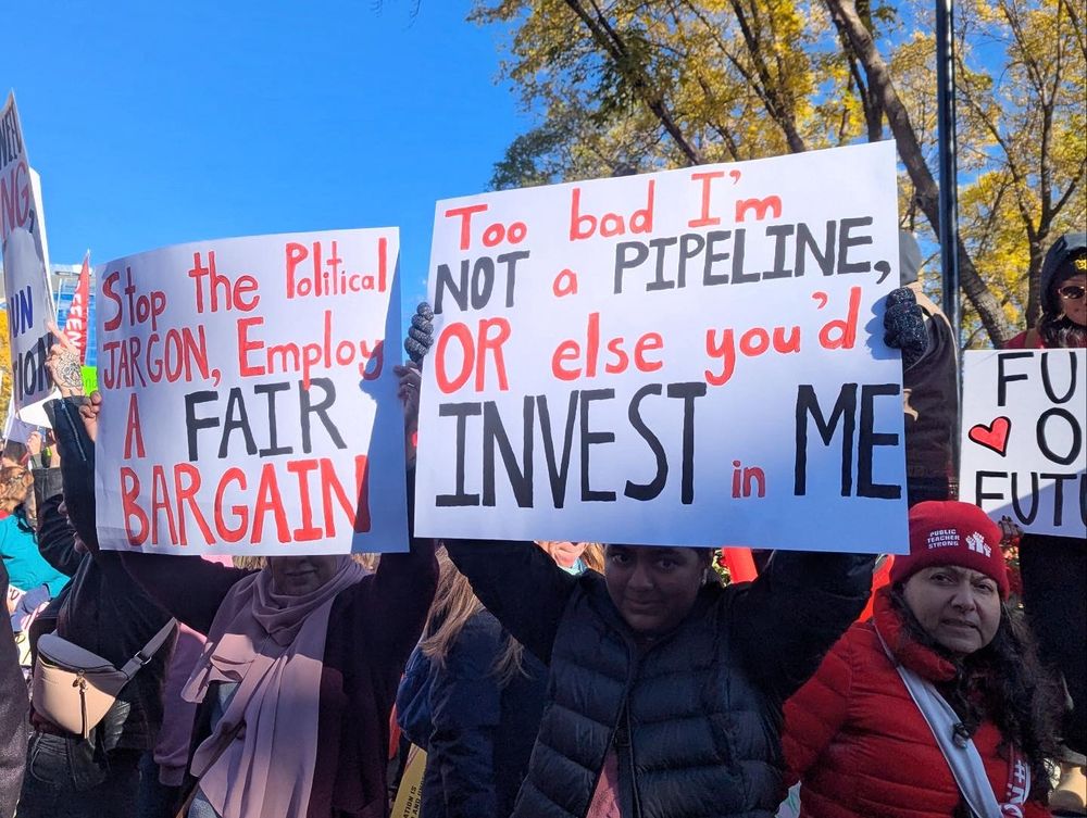 “Too bad I’m not a poodle or else you’d invest in me” protest sign