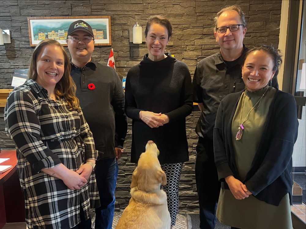 A photo of PIPSC members, Heather McPherson and her dog, Holly
