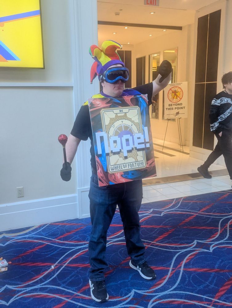 A guy dressed up like the Wheel of Fortune card from Balatro.
