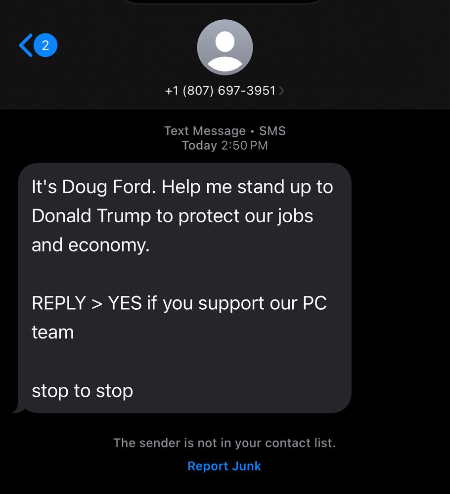 A screenshot of a text message from an unknown number (+1 807-697-3951) claiming to be from Doug Ford. The message urges the recipient to stand up to Donald Trump to protect jobs and the economy and asks them to reply “YES” if they support the PC team. It also provides an option to reply “stop” to unsubscribe. The sender is not in the recipient’s contact list, and there is an option to “Report Junk” at the bottom.
