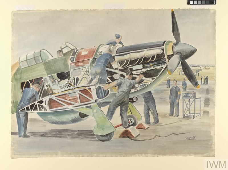 Men work on the engine and body of a Hawker Hurricane, which does not have its wings attached.