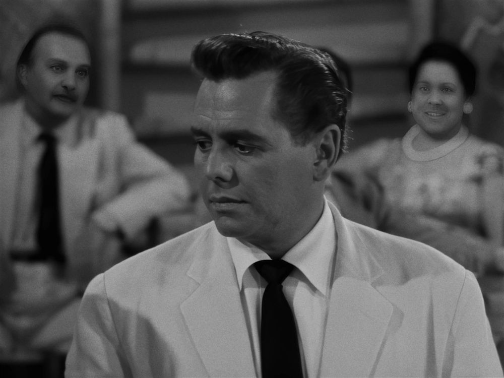 blurred people in a background shot with extremely sharpened and disorienting AI faces
