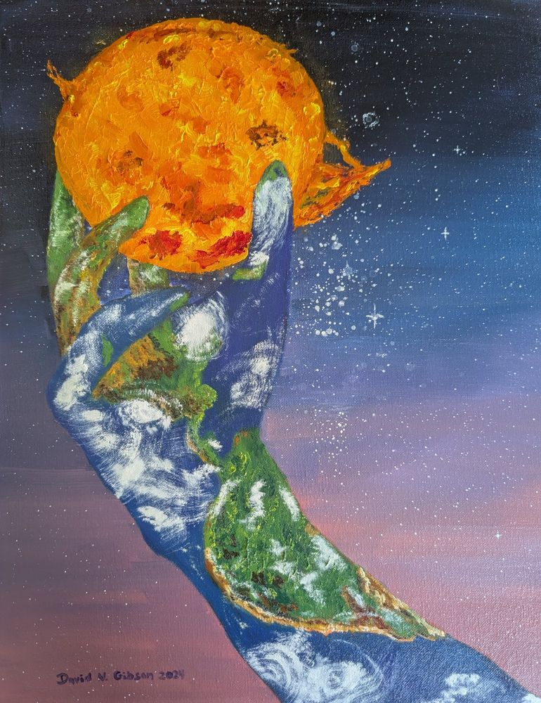 Hand holding the sun with the earth painted on it. 