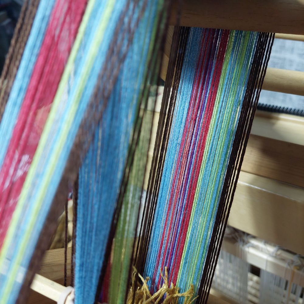 A warp, ready to be woven, on an inkle loom