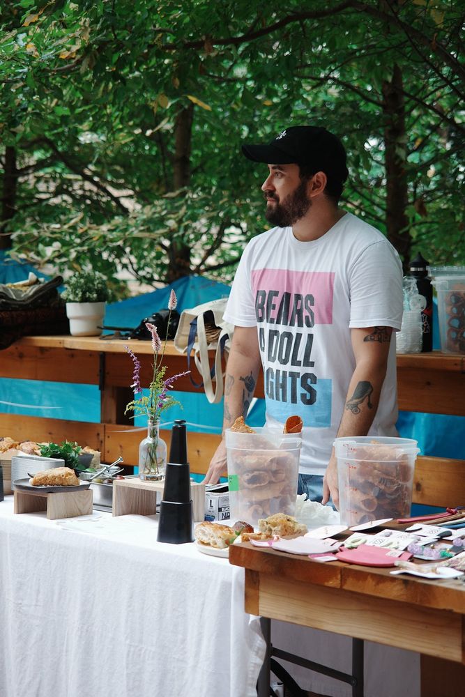a pic of me wearing a bears for doll rights shirt at my pop up booth 