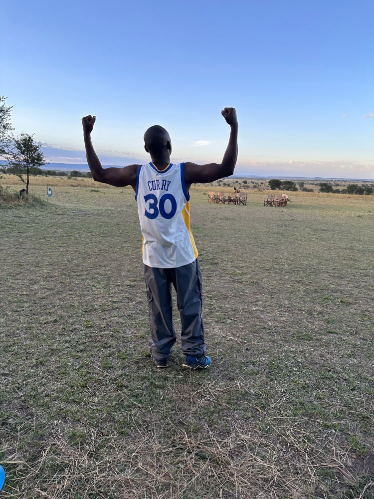 Back of the guide wearing a curry jersey in the Serengeti.