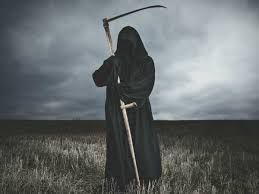A photo of the Grim Reaper, a figure in hooded black robes carrying a scythe 