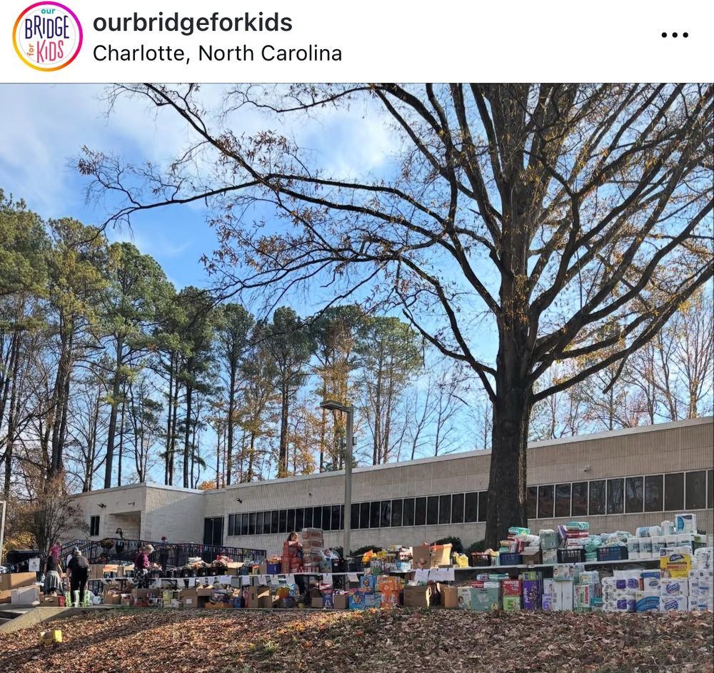 Supplies including paper goods are stacked in labeled categories outside of Charlotte’s Our Bridge for Kids on Friday, Nov. 21.