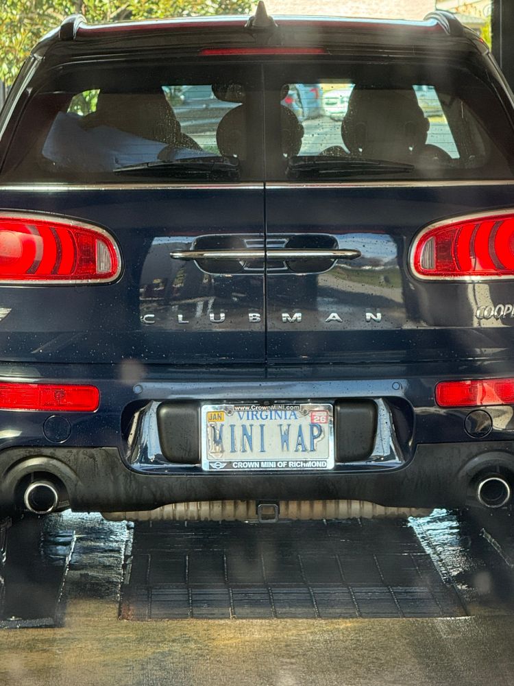 A mini cooper with a license plate that says MINI WAP