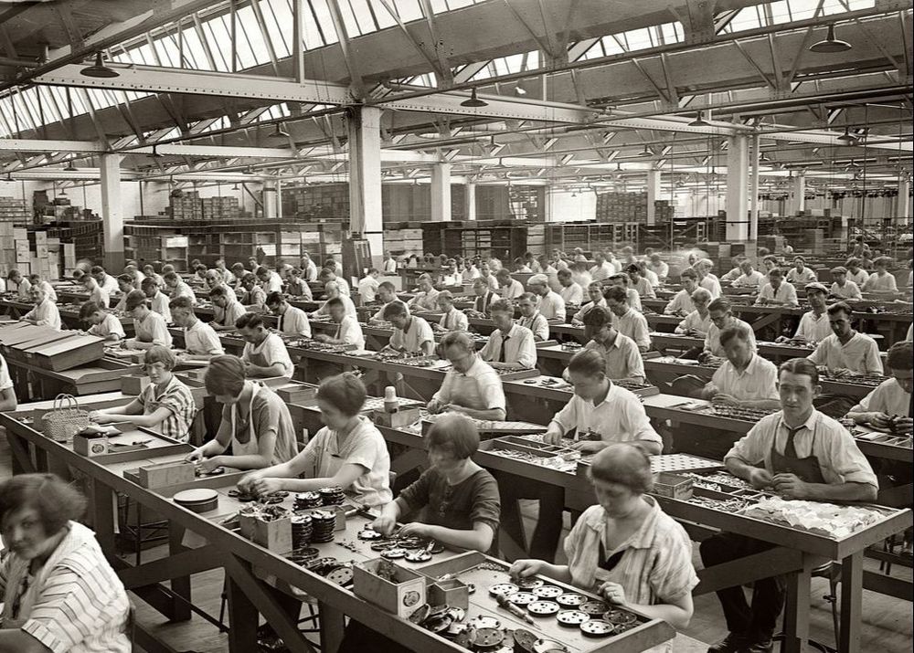 Industrial Revolution era photos of workers working in assembly lines. 