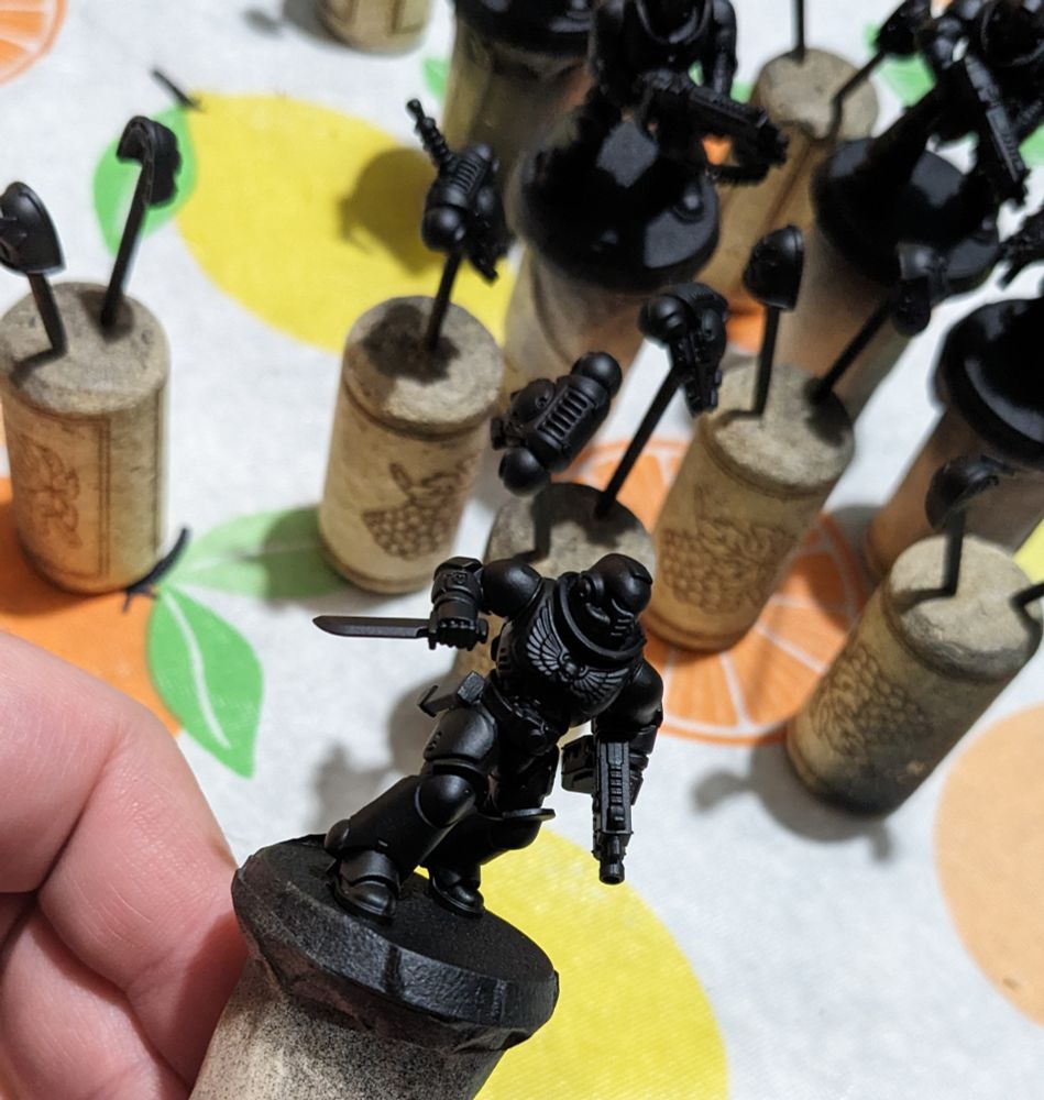 Airbrush black primed Black Templar Warhammer 40k models.