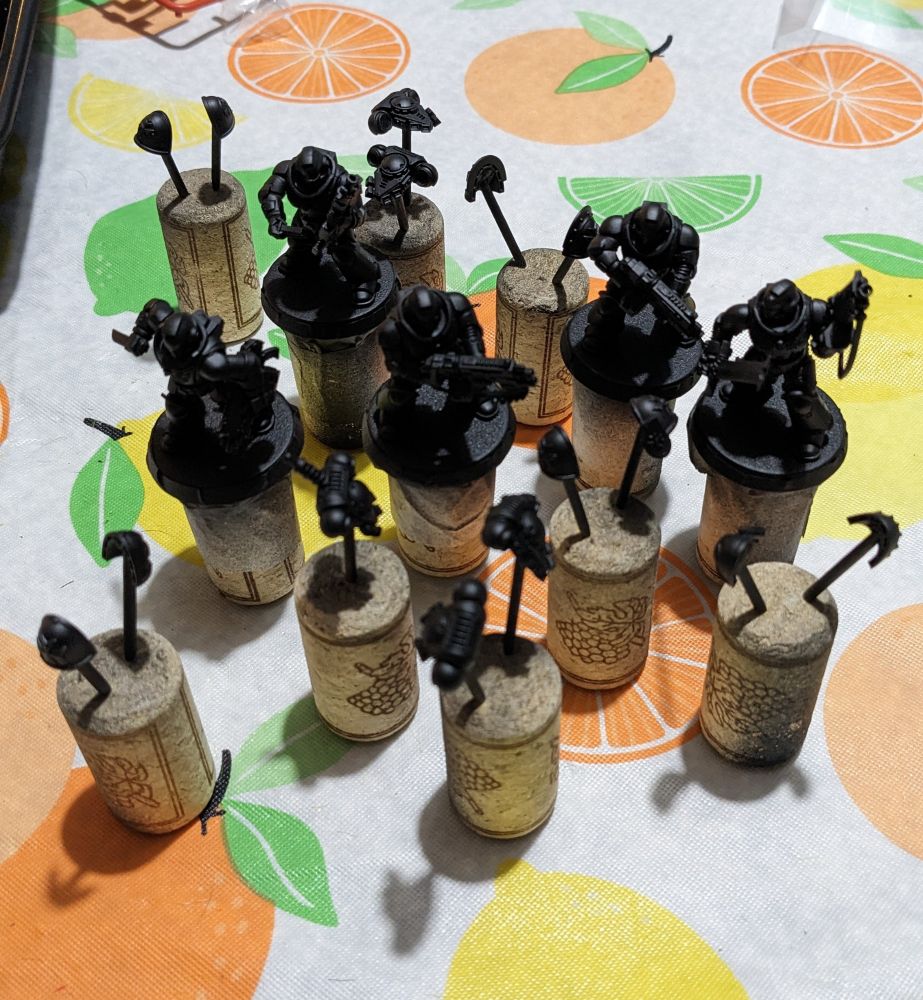 Airbrush black primed Black Templar Warhammer 40k models.