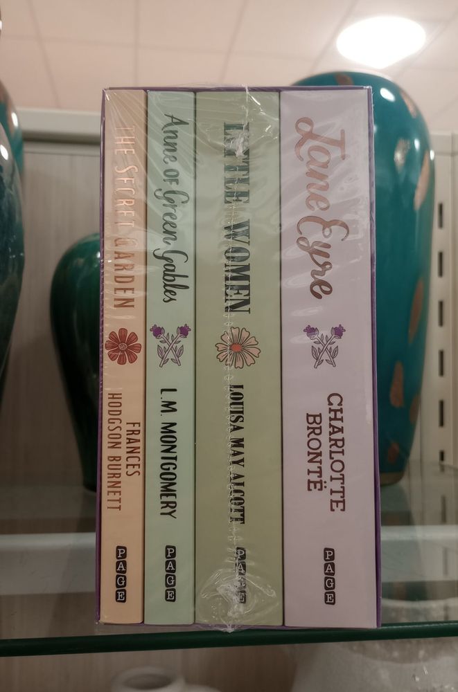 photo of four books packaged all together, but one of these things is not like the other: The Secret Garden, Anne of Green Gables, Little Women, and Jane Eyre
