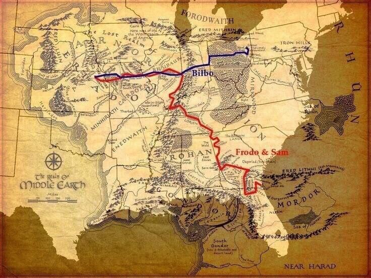 A weathered fantasy map of Middle Earth from The Lord of the Rings, showing two different journey routes marked in contrasting colors. The red line shows Frodo and Sam's path from the Shire to Mordor, while the blue line shows Bilbo's earlier journey as depicted in The Hobbit. The map includes familiar locations like the Shire, Rohan, and Mordor, with mountains and forests illustrated in a classic Tolkien-style cartography. The map appears aged with sepia tones and includes text labels in stylized fantasy font. A compass rose and scale bar are visible in the lower left corner, and the title reads "The Map of Middle Earth.