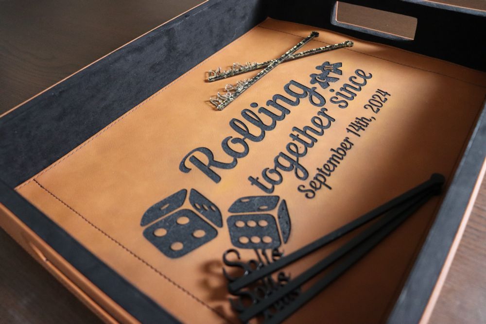 A custom engraved leather tray for the happy couple.
