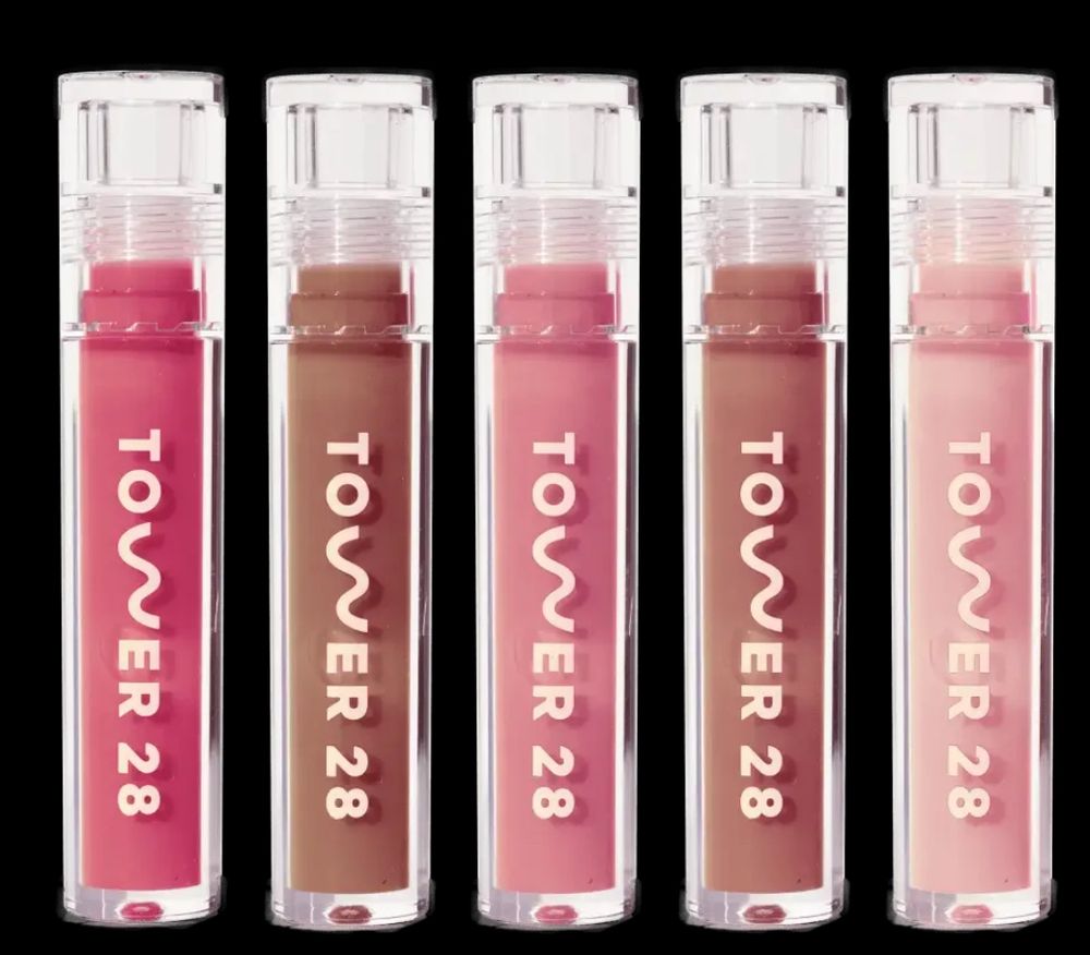 5 different colors of the Tower 28 Milky Lip Glosses