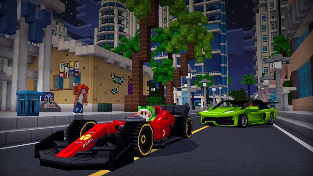 A city street in Minecraft at night with a red racing car and a green sports car parked on the road, and a person standing on the sidewalk nearby.