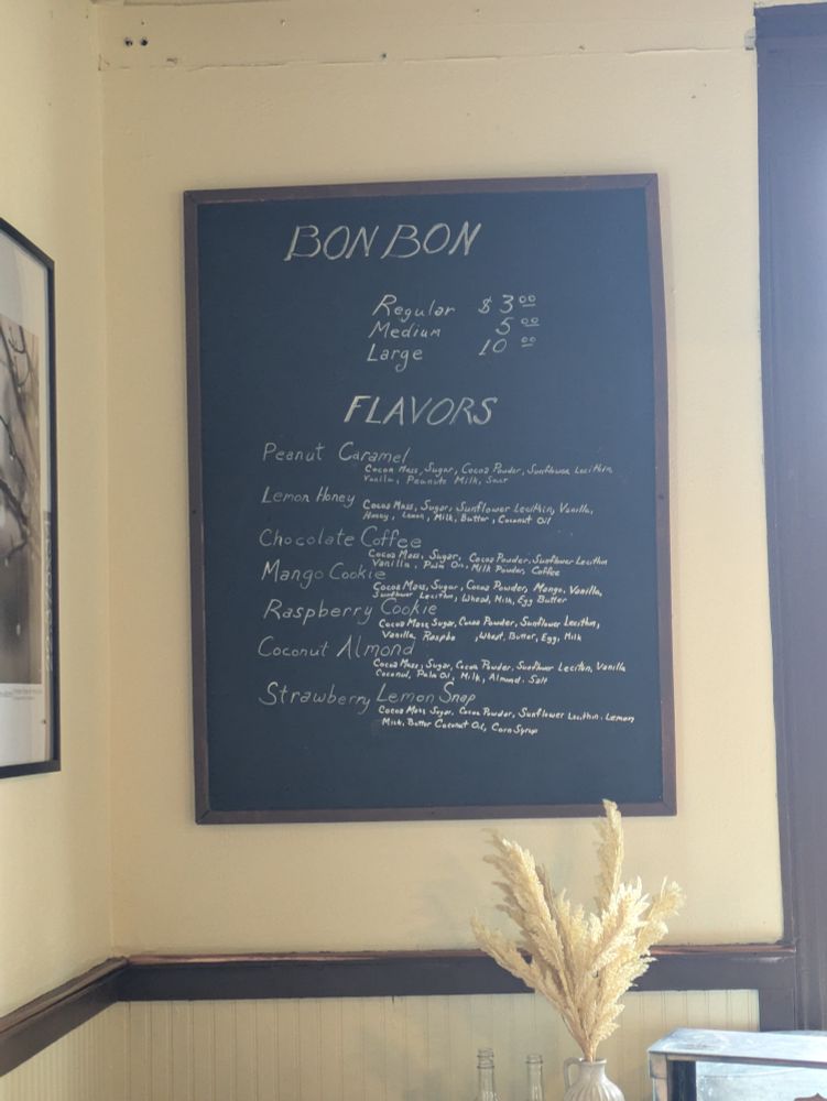 The menu of bon bons including peanut caramel, lemon honey, chocolate coffee, mango cookie, raspberry cookie, coconut almond, and strawberry lemon snap