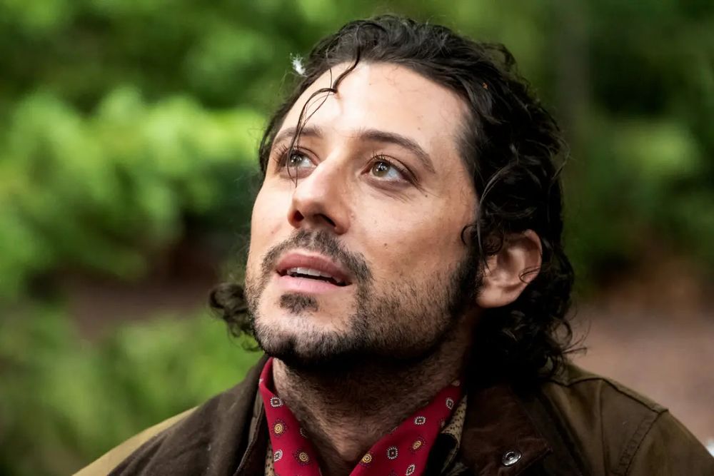 Eliot from The Magicians looking up 