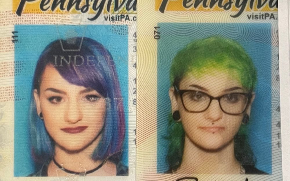 Two ID photos side by side
On the left is Sydney at 19 with shoulder length purple bob 
On the right is Sydney at 27 with green mullet and glasses 
