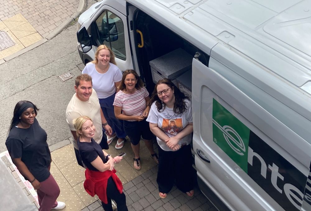 RMS staff stand next to a van packed with items to take to mmc2025