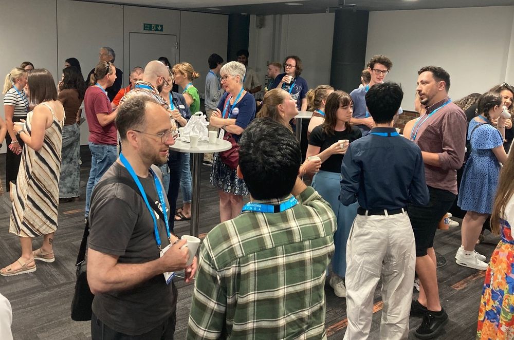 Attendees at the Early Career Symposium chat during a coffee break.
