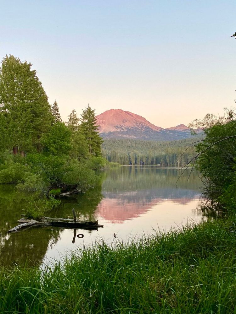 A photo of Mountain Lassen at dusk reflected in Manzanita Lake