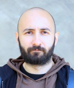 A headshot of Dr Burak Yelmen.