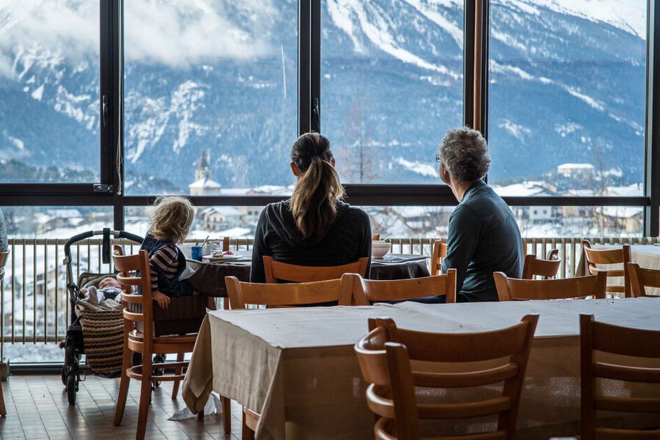 People having breakfast in front of the Alps in the Centre Paul Langevin.