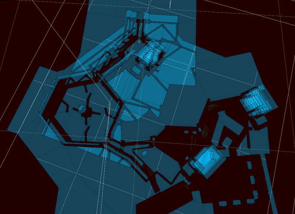 top down view from within the unity editor, showing a black and blue visual of a level. The level is in the shape of the notorious octagonal prison layouts. It looks posterized and stylistic, because only the navmesh components (blue) are visible and the level itself is invisible.