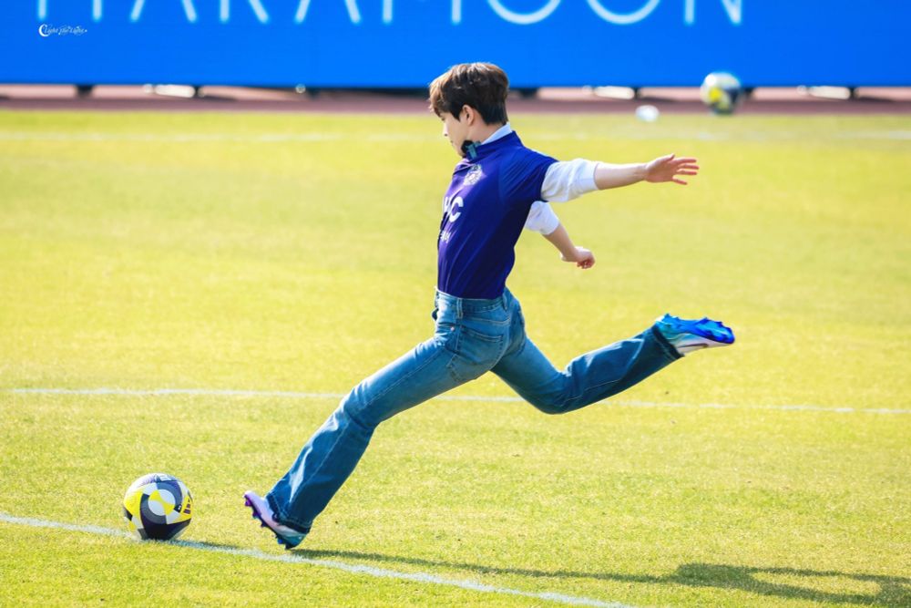 Picture of Hongjoong shooting a soccer ball