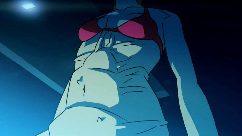 A screenshot from the "DyE - Fantasy" music video. A woman's torso is distended unnaturally with a segmented, wormlike tentacle. Her loose skin is pulled downwards around it, wrinkling unsettlingly like wet fabric or a popped blister, as if the massive appendage is only beneath her skin and not fully inside her body.