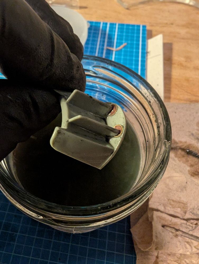 Stripping paint from a plastic model part 😩