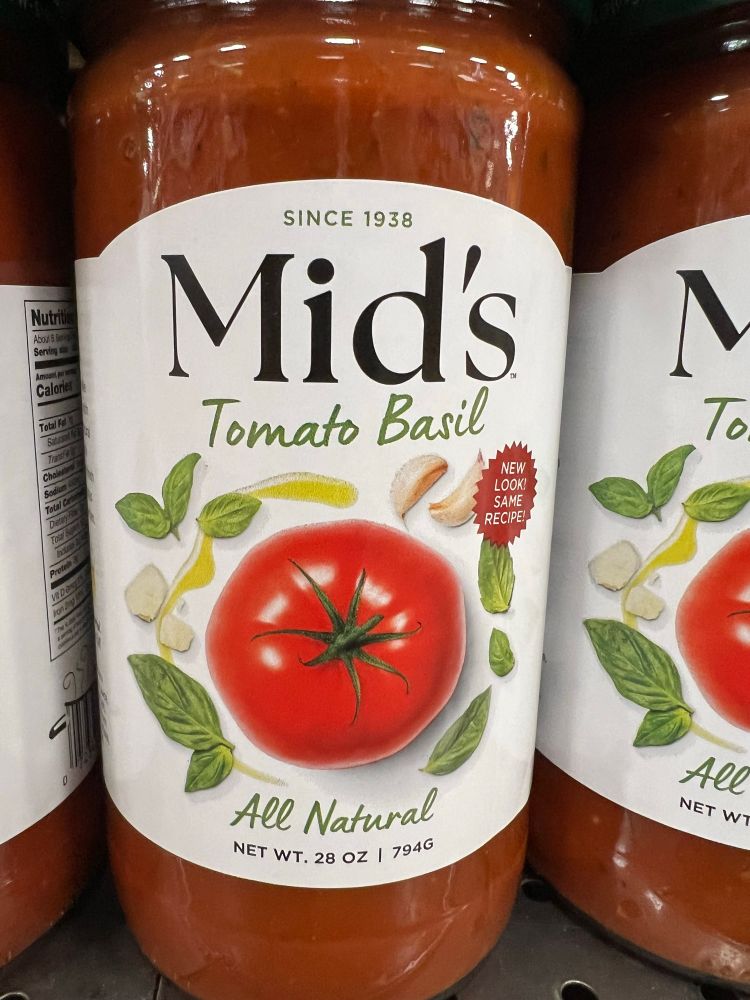 A jar of tomato basil pasta sauce from the brand Mid’s