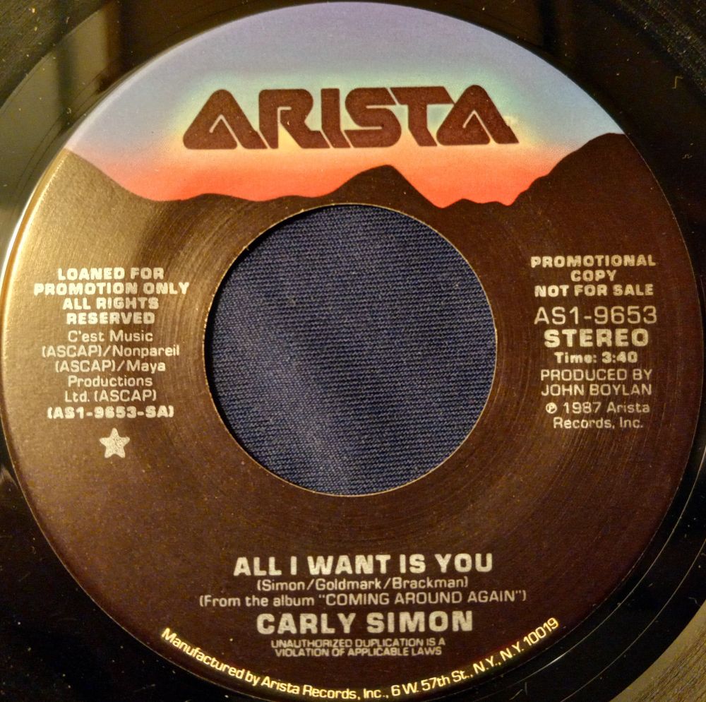 An image of the vinyl of "All I Want is You", the 45 RPM single release, by Carly Simon on Arista Records from 1987. From the album, "Coming Around Again". (Same on both sides)