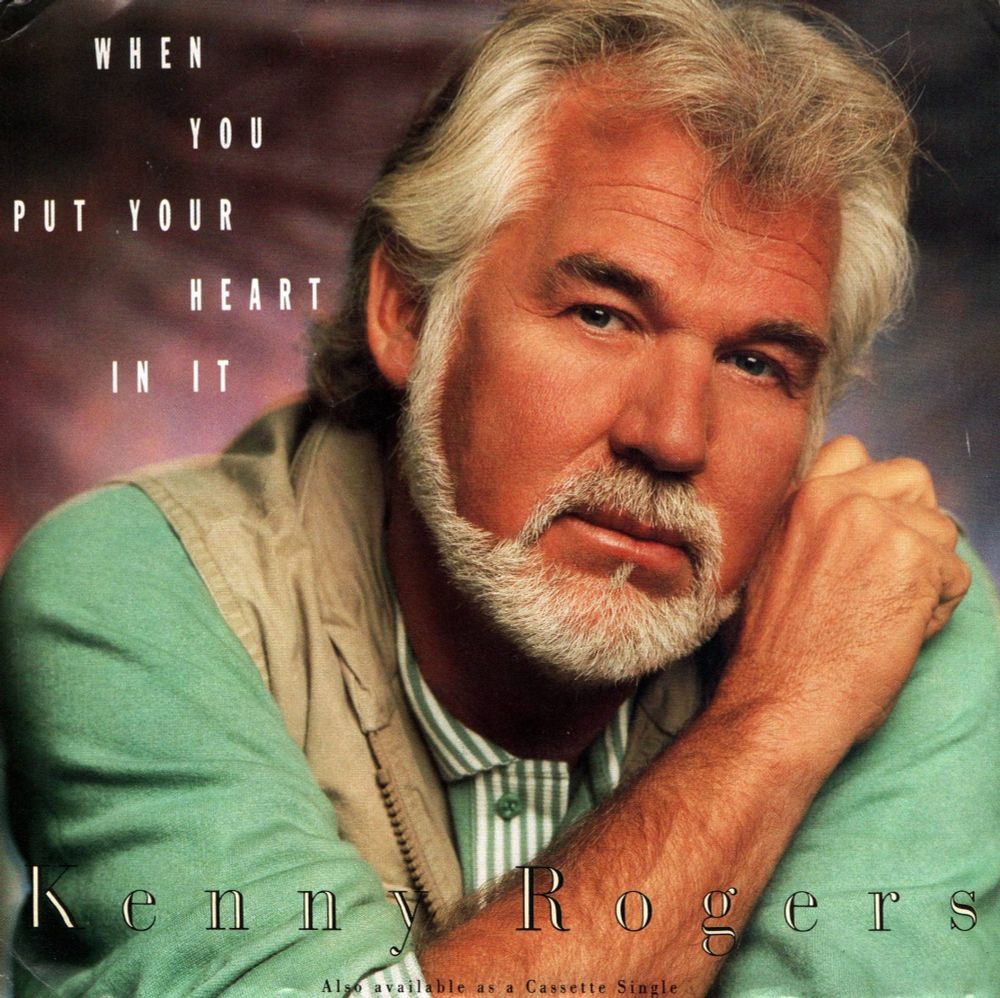 This is the front cover to the Kenny Rogers single, "When You Put Your Heart in It". A great picture! He's looking right into the camera with a serious expression in this shot, which looks as though he's looking right at you.