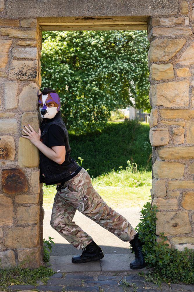 me standing in one of the castle's doorframes, posing sluttily and staring daringly at the camera