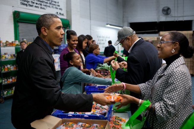 President Barack Obama, First Lady Michelle Obama, daughters Malia and Sasha, and Marian Robinson greet people as they fill care packages with food for Thanksgiving at the Capital Area Food Bank in Washington, D.C., Nov. 23, 2011. (Official White House Photo by Pete Souza)

https://obamawhitehouse.archives.gov/node/100441