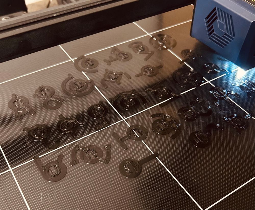 All the forms of the Pokémon Unown in the process of being 3D printed.
(Please excuse the build plate… I know it’s dirty.)