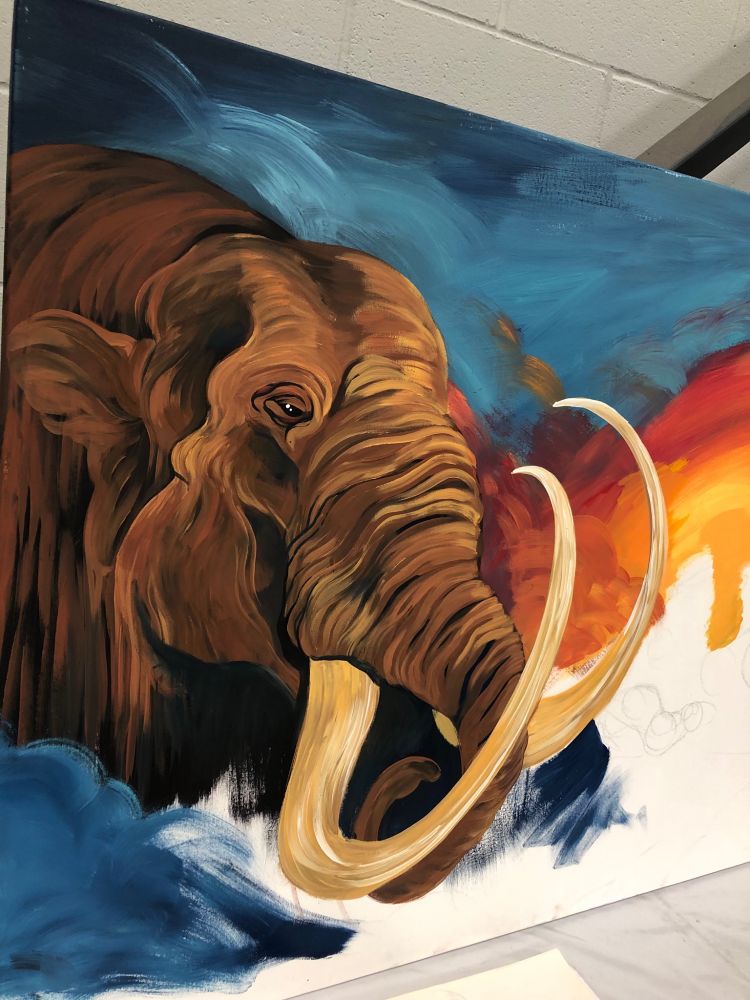 In-progress art. Acrylic paint on canvas featuring a mastodon. 