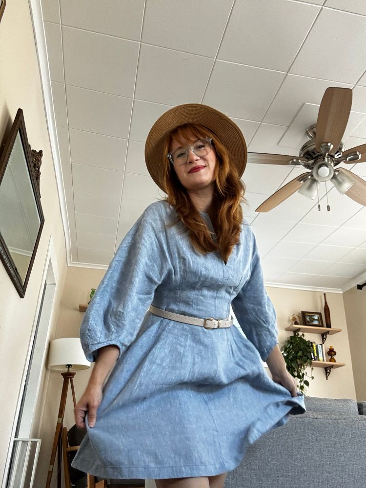 Selfie in a blue dress and sun hat 