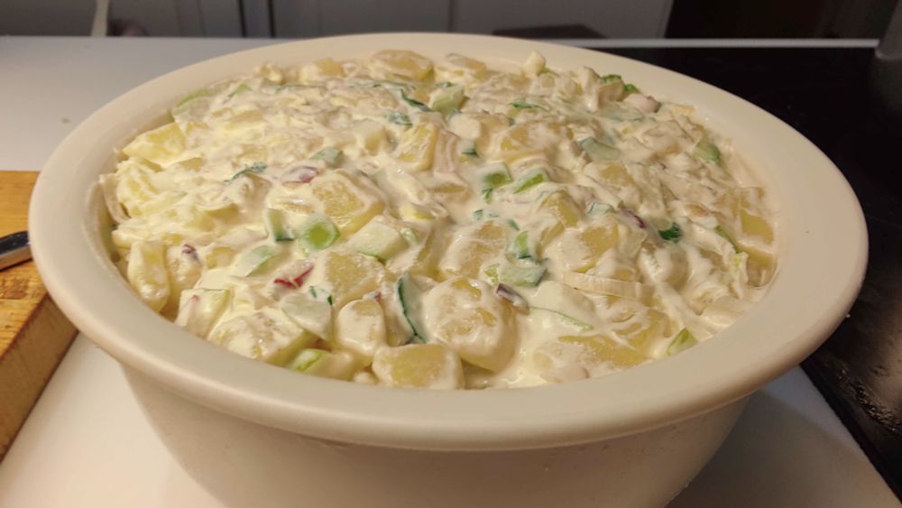 Closeup photo of a bowl of homemade potato salad.