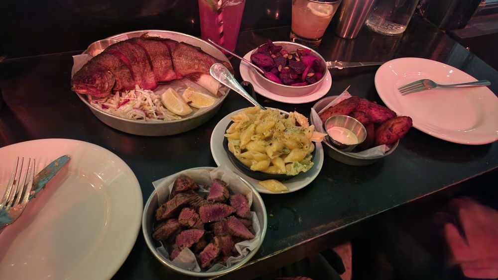 Fried trout, harissa smoked veggies, fried plantains, green chile mac and cheese, Colorado lamb