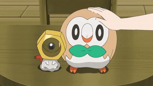 a person petting a cartoon owl with the numbers 00 on it 's face