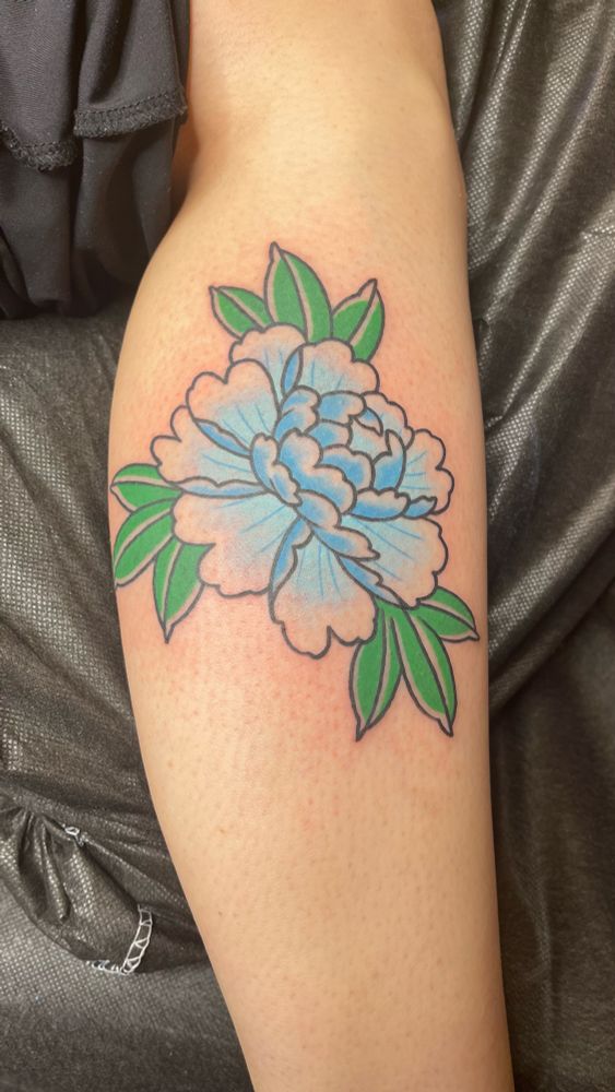 Traditional Japanese tattoo of a beautiful blue peony flower 