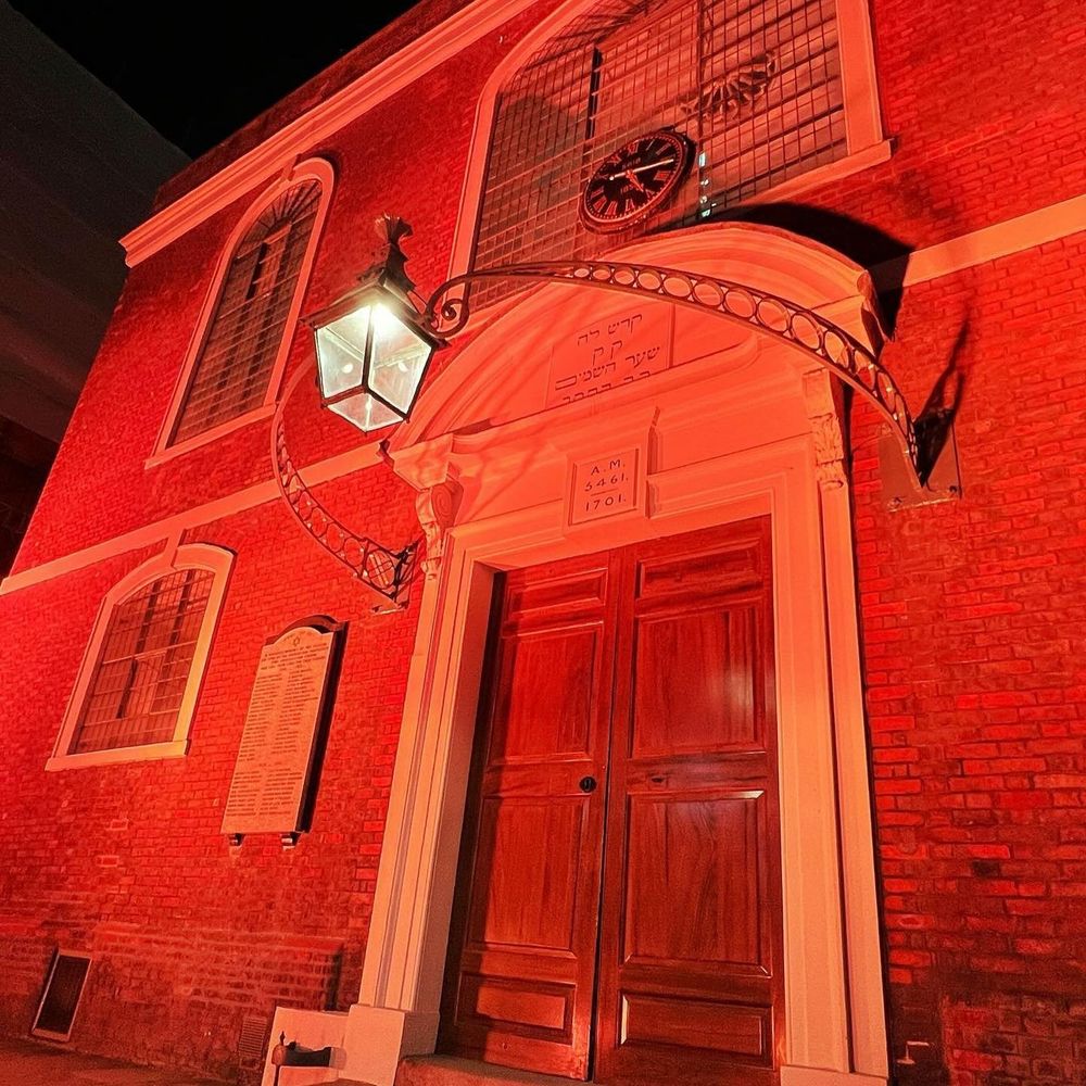 Bevis Marks Synagogue lit up in orange