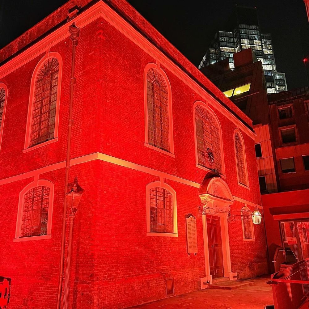 Bevis Marks Synagogue lit up in orange