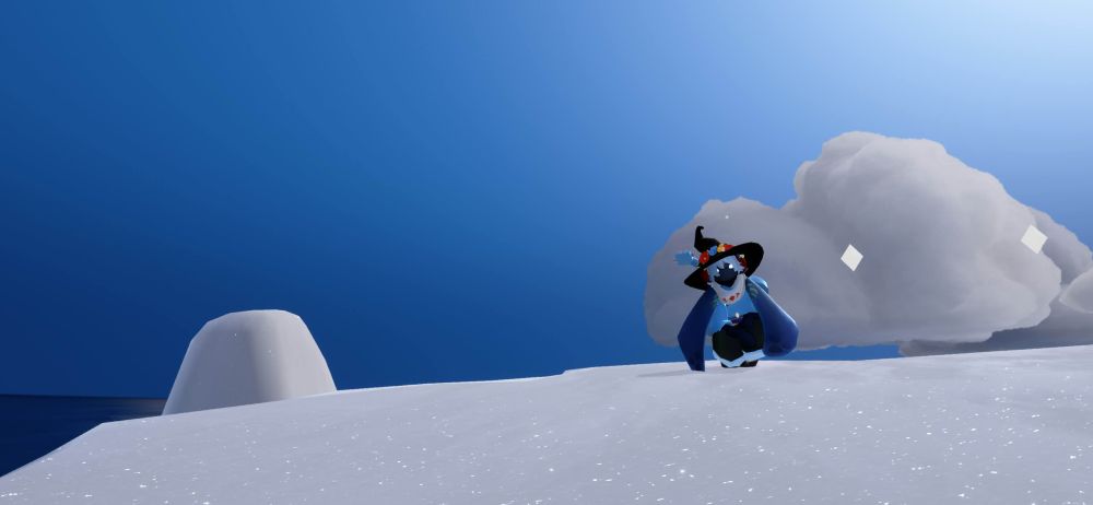 Skycotl sky kid with the travelling spirit cape sitting down