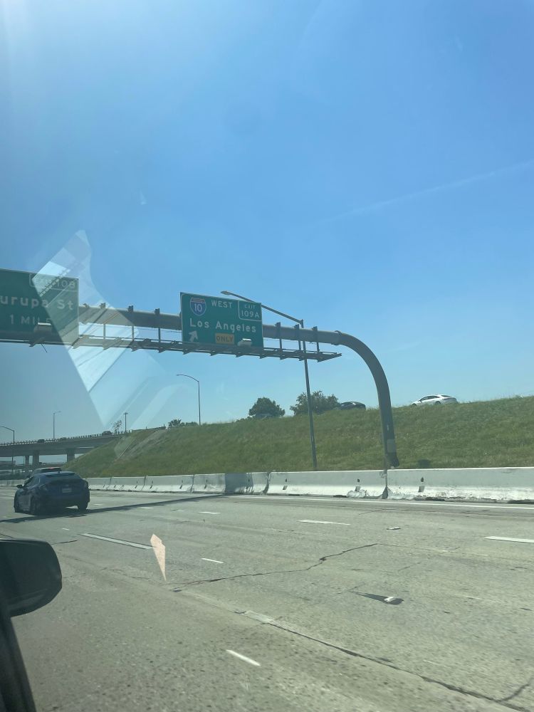 a interstate sign showing an exit to Los Angeles