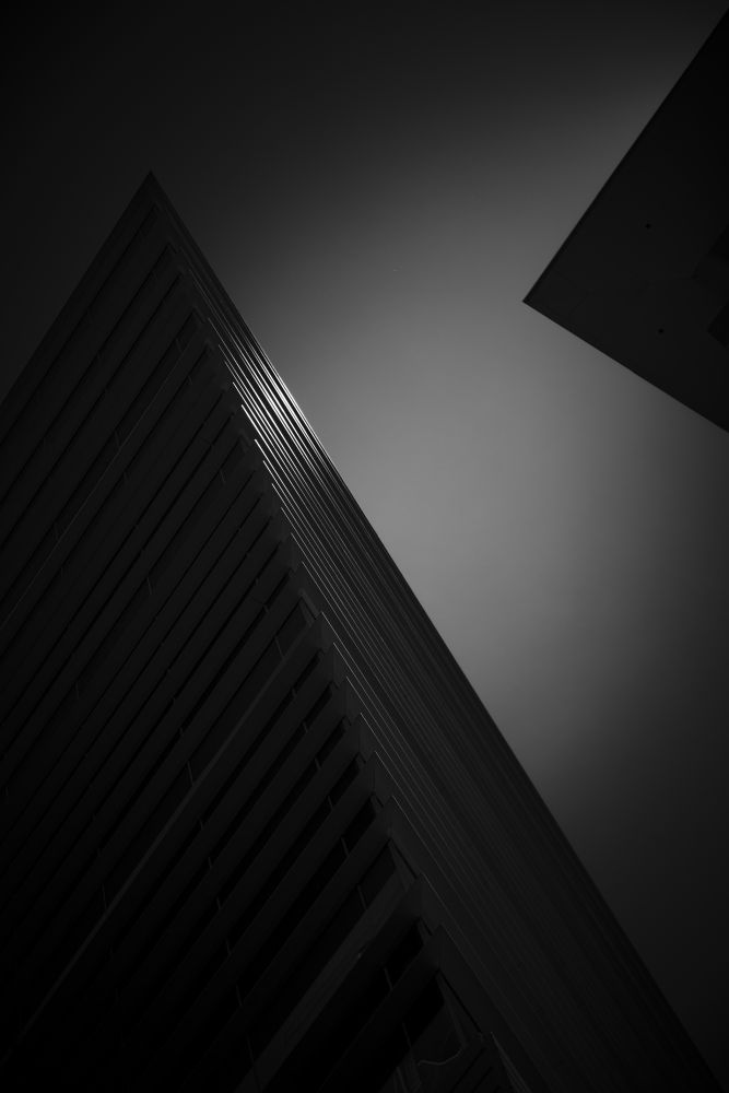 Two darkly lit triangular structures